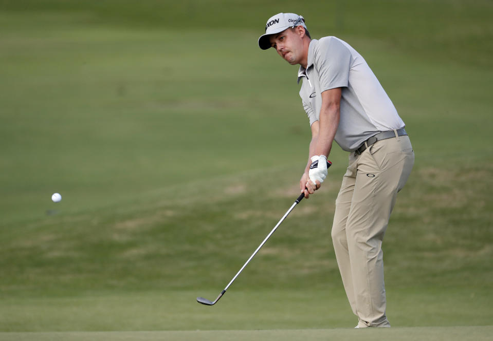 Andrew Putnam hits onto the 10th green during the first round of the Sony Open PGA Tour golf event, Thursday, Jan. 10, 2019, at the Waialae Country Club in Honolulu, Hawaii. (AP Photo/Matt York)