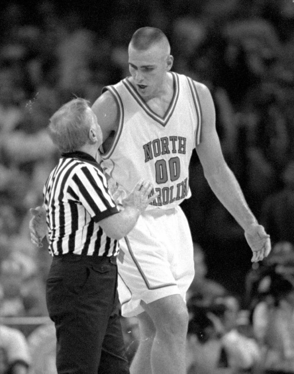 UNC center Erik Montross pleads his case with referee Lenny Wirtz in a 1994 ACC Tournament game. Gary O'Brien/File photo