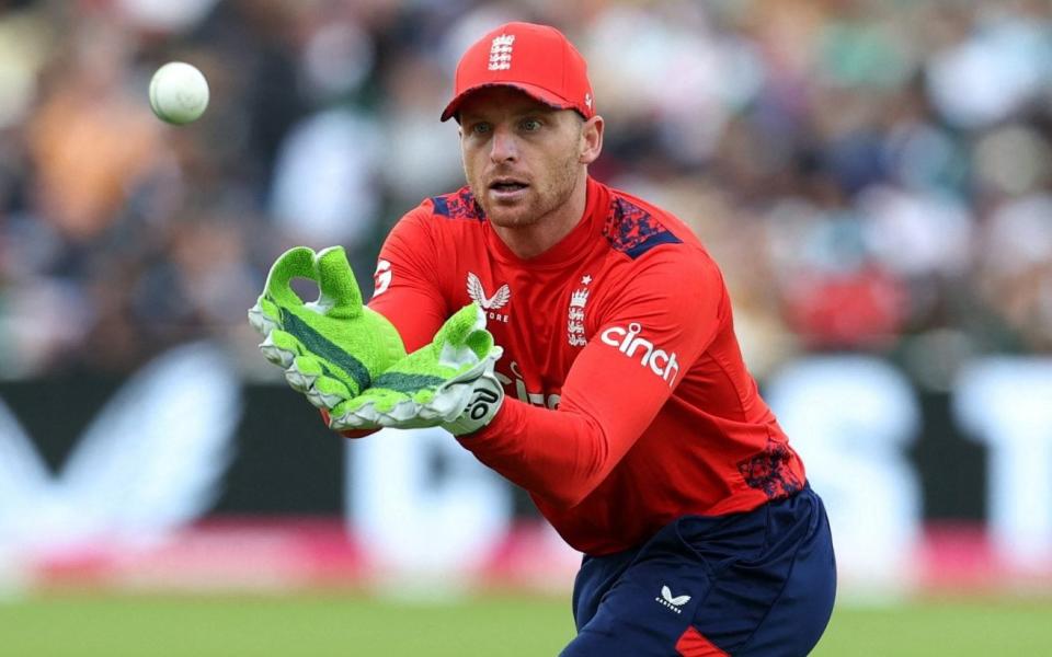 Jos Buttler catches a ball