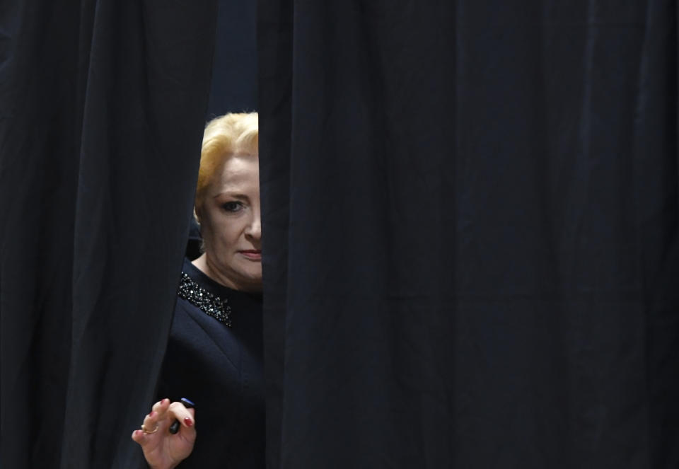 Former Prime Minister and presidential candidate for the Social Democratic party Viorica Dancila exits a voting cabin in Bucharest, Romania, Sunday, Nov. 24, 2019. Romanians are voting in a presidential runoff election in which incumbent Klaus Iohannis is vying for a second term. (AP Photo/Andreea Alexandru)