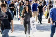 A worker carries a sign during a protest against Google's handling of sexual misconduct allegations at the company's Mountain View, Calif., headquarters on Thursday, Nov. 1, 2018. (AP Photo/Noah Berger)