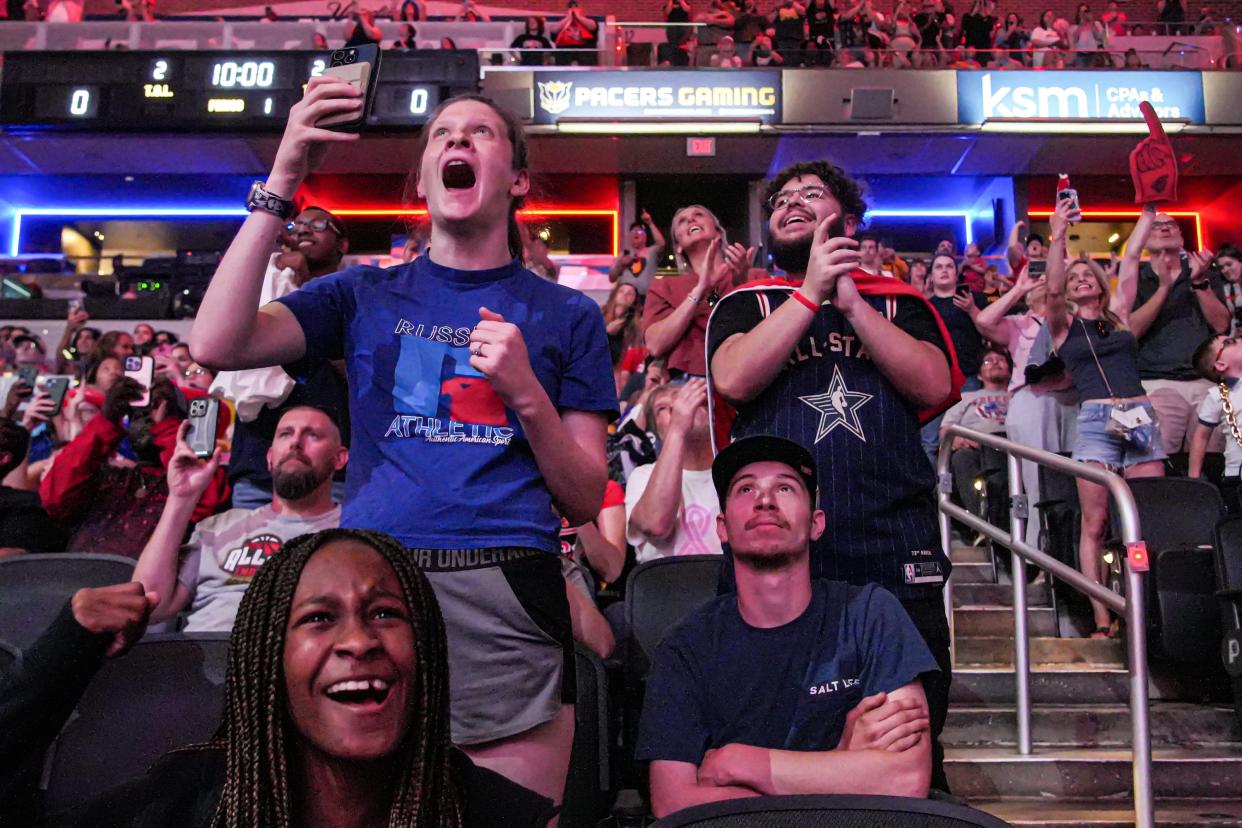 Indiana Fever fans celebrate the No. 1 overall pick of Caitlin Clark during a draft party at Gainbridge Fieldhouse in Indianapolis.