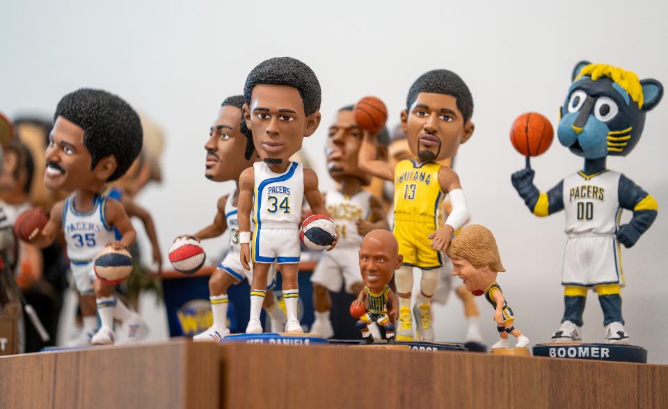 Souvenir toys on a shelf of David Benner, who is retiring at the end of the week as the longtime Director of Media Relations for the Indiana Pacers, Monday, April 4, 2022. 