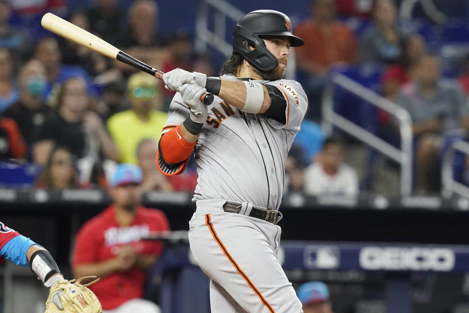 San Francisco Giants Brandon Crawford hits a triple during the second inning of a baseball game against the Miami Marlins, Saturday, June 4, 2022, in Miami. (AP Photo/Marta Lavandier)