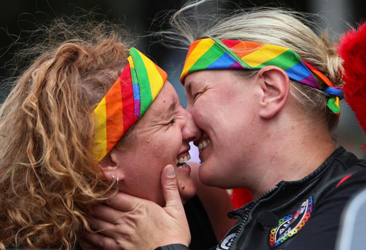 Max Donahue and Georgia Marks take part in the 2023 Pride Parade in London (REUTERS)