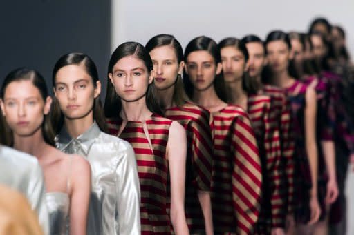 Models present creations by Vitorino Campos during the Sao Paulo Fashion Week 2013 winter collection in Sao Paulo, Brazil, on October 31