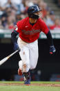 Cleveland Guardians' Andres Gimenez watches his solo home run against the Boston Red Sox during the fourth inning of a baseball game Friday, June 24, 2022, in Cleveland. (AP Photo/Ron Schwane)