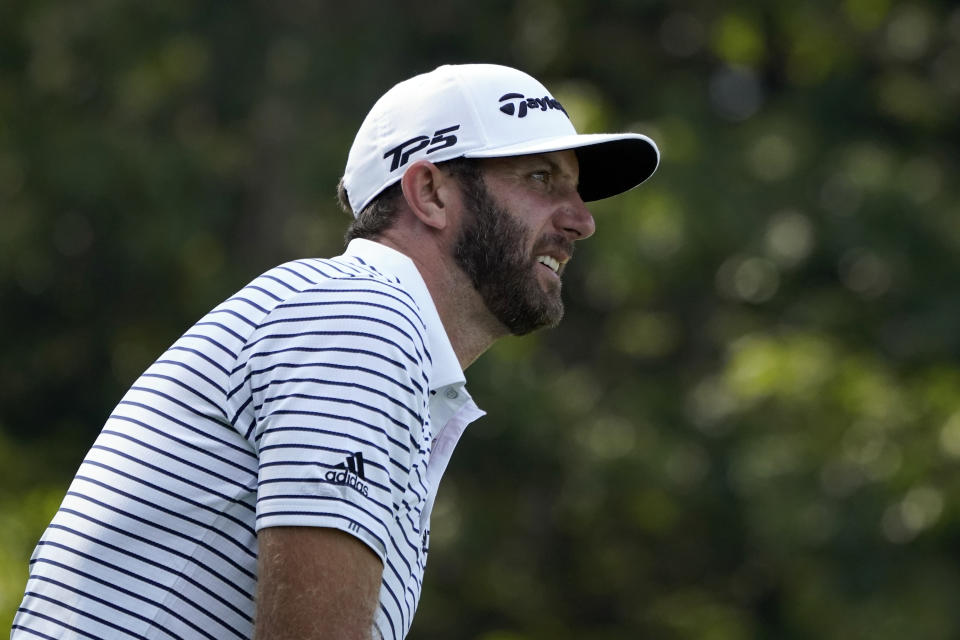 Dustin Johnson watches his shot off the 13th tee during the second round of the Northern Trust golf tournament at TPC Boston, Friday, Aug. 21, 2020, in Norton, Mass. (AP Photo/Charles Krupa)