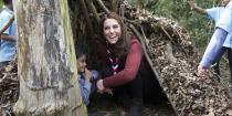 <p>The duchess crouches in a fort built by the Scouts at their London headquarters.</p>