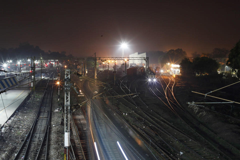 A train approaches a railway station in Allahabad, India.