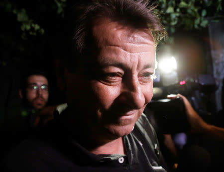 FILE PHOTO: Italian former leftist guerrilla Cesare Battisti leaves the headquarters of Federal Police in Sao Paulo, Brazil March 13, 2015. REUTERS/Nacho Doce/File Photo