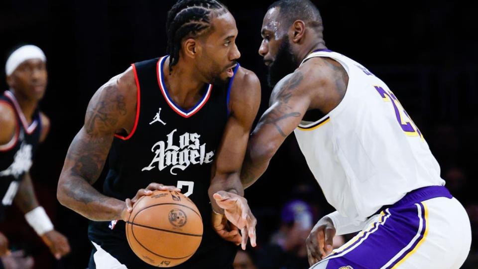 <div>LA Clippers forward Kawhi Leonard (2) handles the ball while Los Angeles Lakers forward <a class="link " href="https://sports.yahoo.com/nba/players/3704/" data-i13n="sec:content-canvas;subsec:anchor_text;elm:context_link" data-ylk="slk:LeBron James;sec:content-canvas;subsec:anchor_text;elm:context_link;itc:0">LeBron James</a>. (Allen J. Schaben / Los Angeles Times via Getty Images)</div> <strong>(Getty Images)</strong>