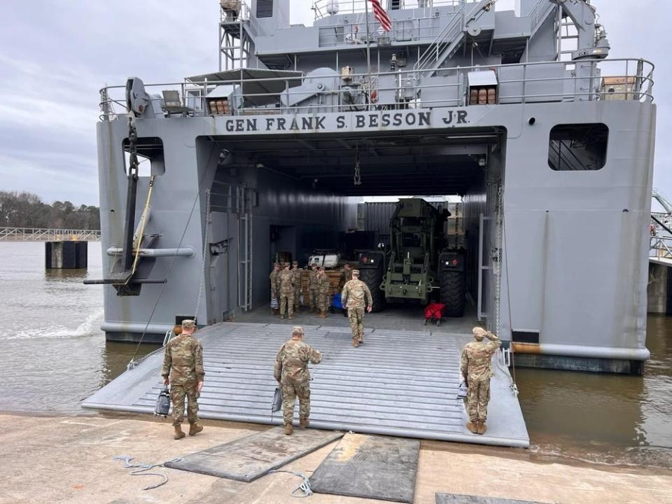 Soldiers are seen boarding US Army Vessel General Frank S. Besson