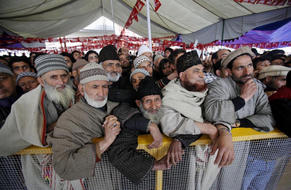 National Conference party supporters attend an election rally on the outskirts of Srinagar, India, Monday, April 7, 2014. India started the world's largest election Monday where the country's 814 million electorate will vote in stages over the next five weeks. (AP Photo/Mukhtar Khan)