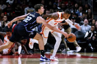 Orlando Magic forward Franz Wagner (22) steals the ball away from Atlanta Hawks guard Dejounte Murray (5) during the first half of an NBA basketball game Friday, Oct. 21, 2022, in Atlanta. (AP Photo/Butch Dill)