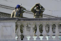 FBI offoicers work security after the after the Inauguration of President Joe Biden on the East Front of the Capitol after inauguration ceremonies, in Washington, Wednesday, Jan. 20, 2021. (AP Photo/J. Scott Applewhite)