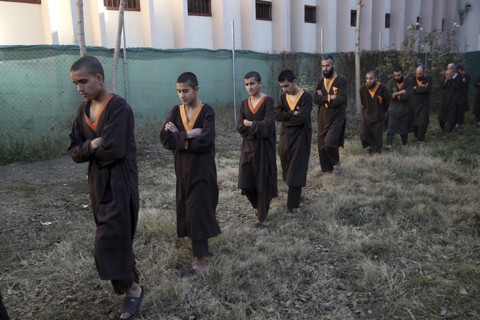 Islamic State militants either arrested or surrounded up to the Afghan government are presented to media in Kabul, Afghanistan, Saturday, Dec. 21, 2019. The country's intelligence service says Saturday that there are more than 75 women and 159 children most of them form foreign countries in the custody of the agency known as the National Deteriorate for Security. (AP Photo/Rahmat Gul)