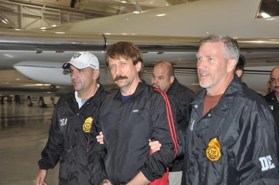 <div class="inline-image__caption"><p>Former Soviet military officer and arms trafficking suspect Viktor Bout (C) deplanes after arriving at Westchester County Airport on Nov. 16, 2010, in White Plains, New York. </p></div> <div class="inline-image__credit">Handout/Getty</div>