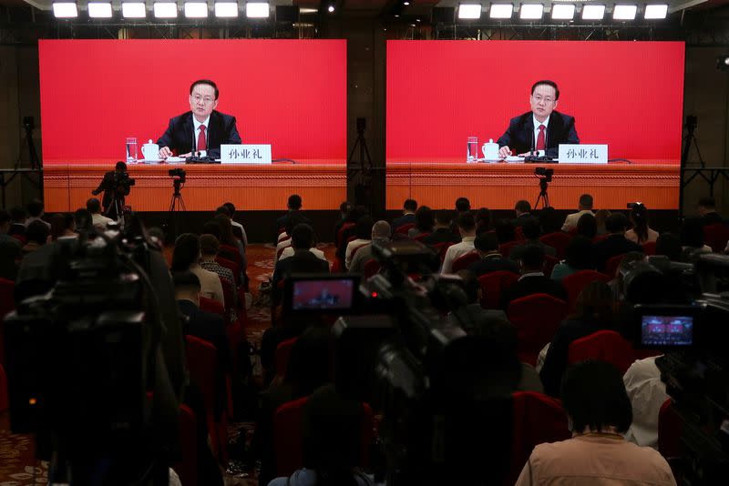 Spokesperson Sun Yeli speaks via video link at a news conference ahead of the 20th National Congress of the Communist Party of China, in Beijing