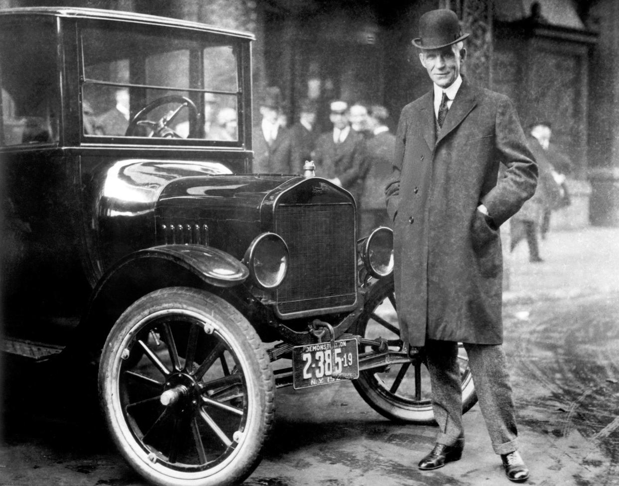 While other auto makers wanted to design luxury cars Henry Ford designed a car that anyone could afford. Here he is standing by that very car. From the collections of The Henry Ford and Ford Motor Company.