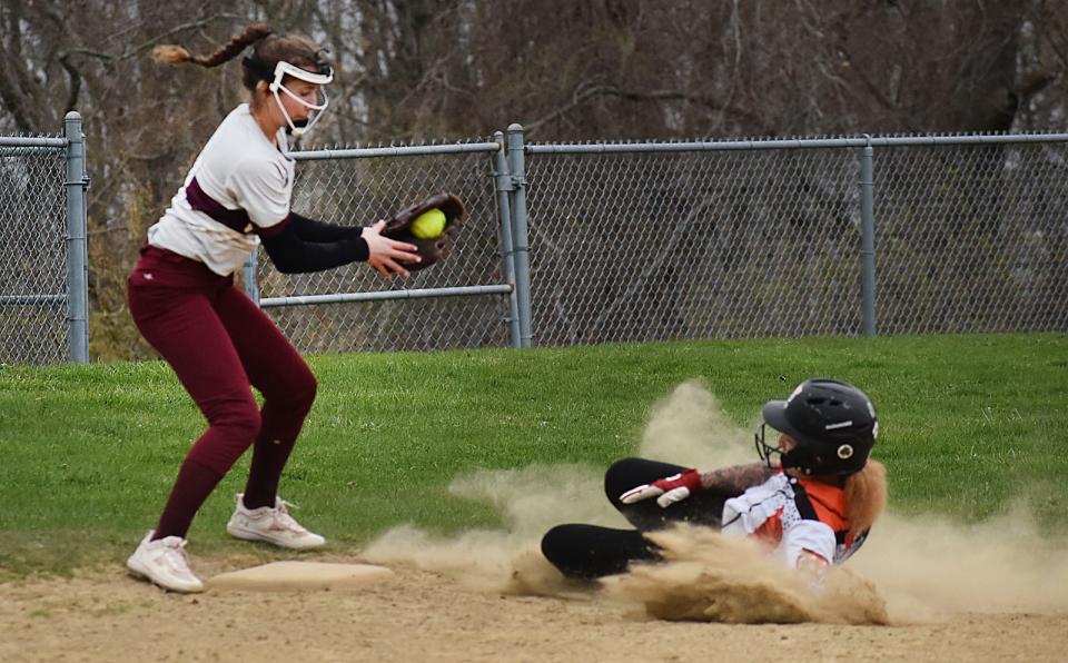 West Bridgewater's Lilly Martel watches as Diman's  Julia Gardner slides safe at third.