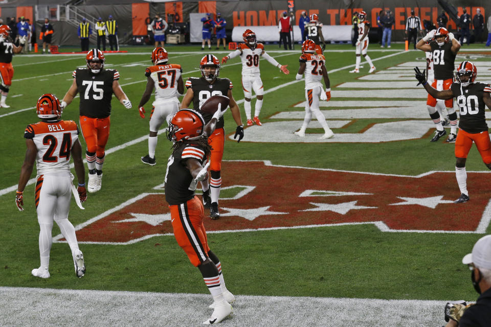 Cleveland Browns running back Kareem Hunt, front, celebrates a 6-yard touchdown against the Cincinnati Bengals during the first half of an NFL football game Thursday, Sept. 17, 2020, in Cleveland. (AP Photo/Ron Schwane)