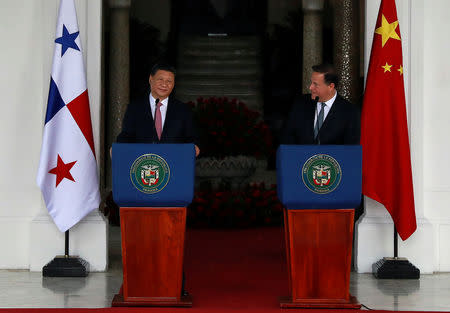 China's President Xi Jinping and his Panamanian counterpart Juan Carlos Varela deliver a joint message after a private meeting as part of Xi's first state visit to Panama, at Presidential Palace in Panama City, Panama December 3, 2018. REUTERS/Carlos Jasso