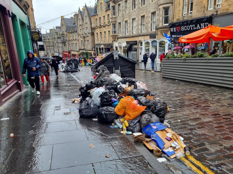 Waste is overflowing from bins on a street amid a strike by waste services workers in Edinburgh