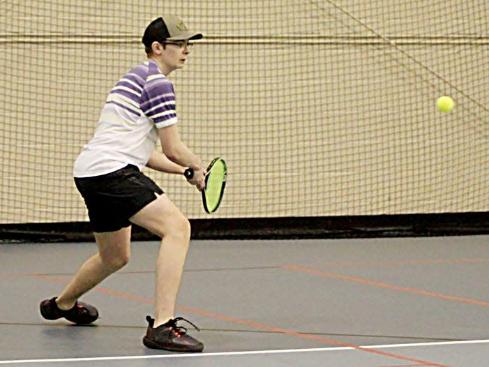 Sam Karst of Watertown prepares to hit the ball during a high school boys tennis triangular on Thursday, April 6, 2023, at the NFAA Easton Center in Yankton.