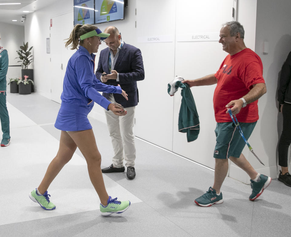 In this photo provided by Tennis Australia, Sofia Kenin, left, of the U.S. is greeted by her father Alex after defeating Spain's Garbine Muguruza in the women's final at the Australian Open tennis championship in Melbourne, Australia, Saturday, Feb. 1, 2020. (Fiona Hamilton/Tennis Australia via AP)