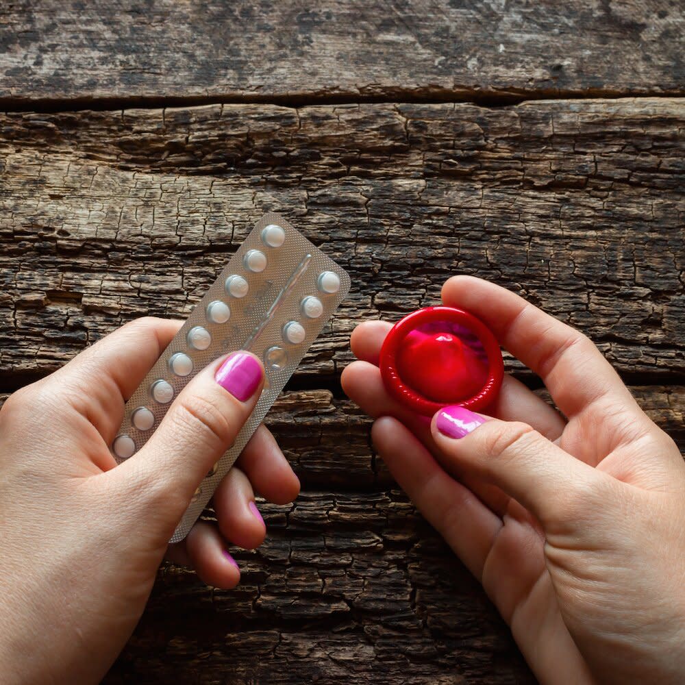 hands-holding-condom-pills.jpg