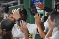 Pittsburgh Pirates' Anthony Alford is greeted in the dugout after his solo home run against the Washington Nationals during the seventh inning of a baseball game Friday, Sept. 10, 2021, in Pittsburgh. (AP Photo/Keith Srakocic)