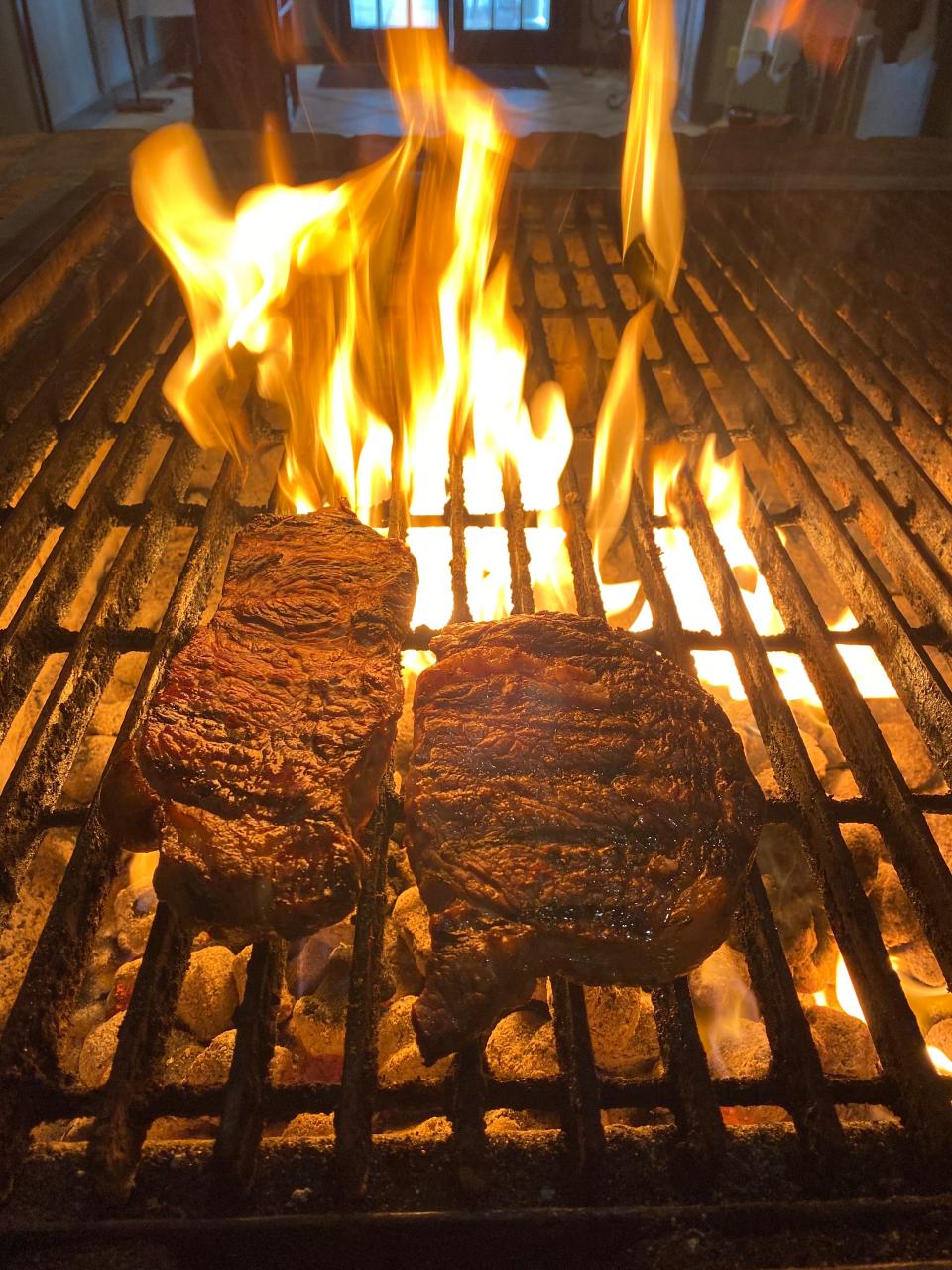 Steaks on the grill at The Butcher Shop in Cordova, TN. The restaurant known for its exhibition cooking celebrates its 40th anniversary in 2021.