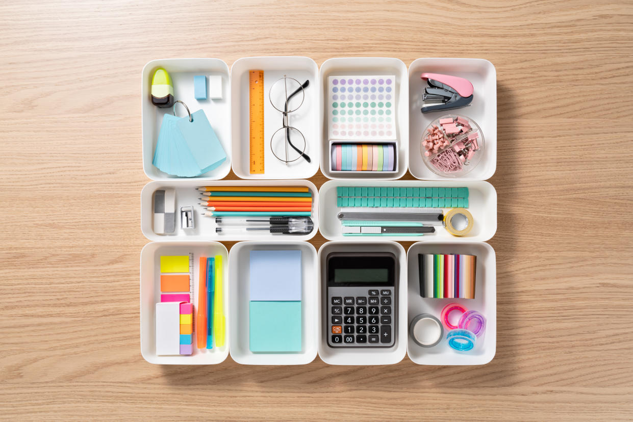 Neatly organised stationery in white tray. (Photo: Getty)