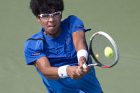 Hyeon Chung of South Korea hits a return to Stan Wawrinka of Switzerland during their second round match at the U.S. Open Championships tennis tournament in New York, September 3, 2015. REUTERS/Carlo Allegri