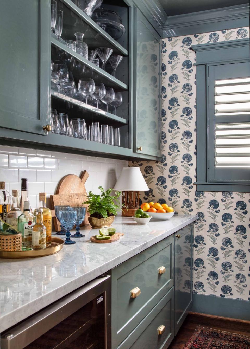 bar cabinets filled with clear glasses