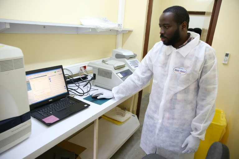 Viral sleuth: doctor Illich Mombo analyses the results of an Ebola test at the Franceville International Centre for Medical Research