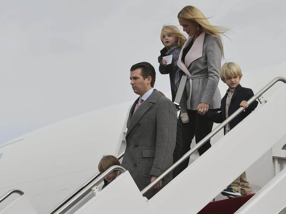 Donald Trump Jr. and wife Vanessa exit a plane with their children