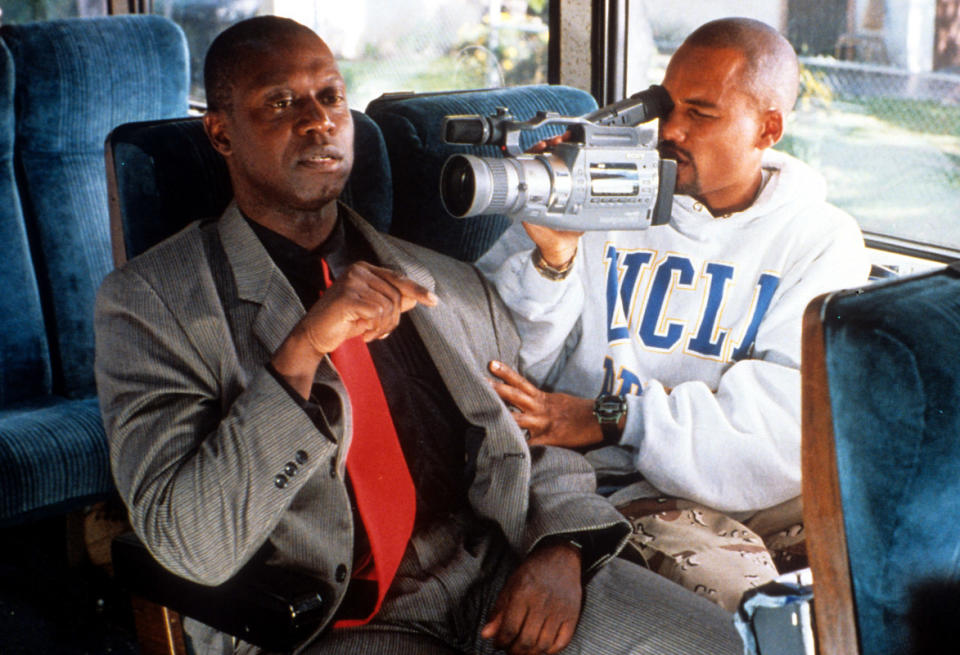 Hill Harper video taping Andre Braugher on the bus in a scene from the film 'Get On The Bus'<p>Universal/Getty Images</p>