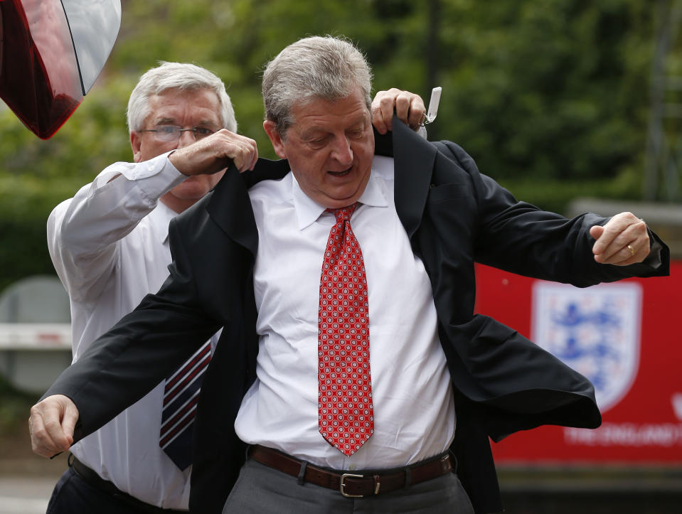 England's soccer manager Roy Hodgson arrives to announce the national squad for the upcoming World Cup in Brazil, in Luton, England, Monday, May 12, 2014. (AP Photo/Sang Tan)