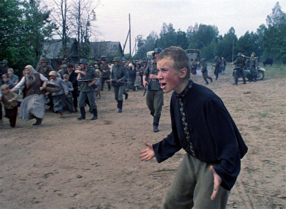 A young man screams as Nazi soldiers begin to round-up villagers in Russia