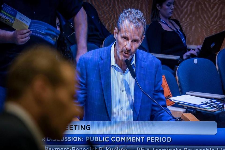 David Centner is seen on a TV screen inside Miami City Commission chambers as he addresses elected officials during the public comment portion of the City Commission meeting on March 14, 2024.