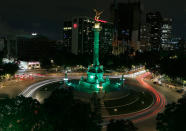 <p>Cars drive past the Angel of Independence monument, lit up in green in Mexico City, Thursday, June 1, 2017. Mexico City’s Mayor Miguel Angel Mancera announced on his Twitter account that the city would light up in green to reaffirm Mexico’s support for the Paris climate agreement after President Donald Trump withdrew the U.S. from the accord. (AP Photo/Marco Ugarte) </p>