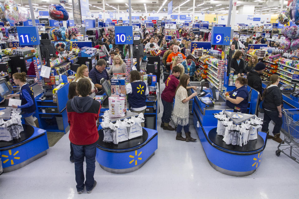 FTSE IMAGE DISTRIBUTED FOR WALMART - Customers wrap up their holiday shopping during Walmart's Black Friday events on Thursday, Nov. 27, 2014 in Bentonville, Ark. Deep savings continue at Walmart Friday though Cyber Monday as part of five days of events in stores and online. (Photo by Gunnar Rathbun/Invision for Walmart/AP Images)