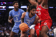 North Carolina guard R.J. Davis (4) attempts to shoot during the second half of an NCAA college basketball game against Ohio State in the CBS Sports Classic, Saturday, Dec. 17, 2022, in New York. The Tar Heels won 89-84 in overtime. (AP Photo/Julia Nikhinson)