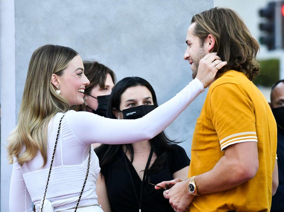 Margot Robbie and Tom Ackerley attend the Warner Bros. Premiere of "The Suicide Squad" at The Landmark Westwood on August 02, 2021 in Los Angeles, California