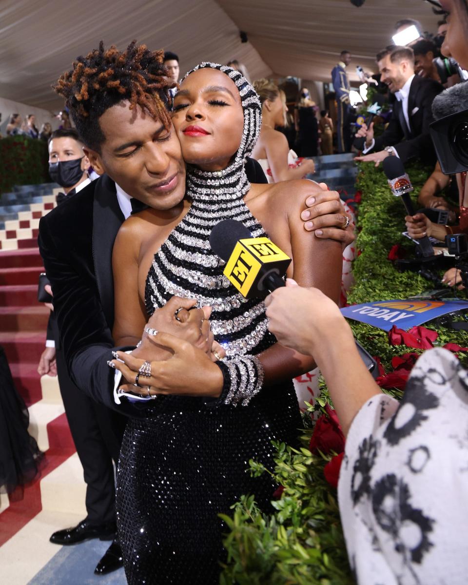 Jon Batiste and Janelle Monae embrace on the Met Gala red carpet on May 2, 2022.
