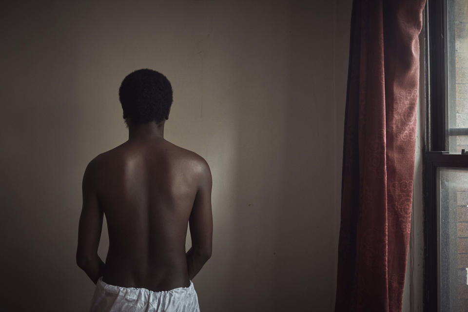 Abdoul, 32 year-old migrant from Maghama, Mauritania poses for a photograph at his shared apartment on Friday, Oct. 6, 2023, in New York. Abdoul traveled from Mauritania to New York via Istanbul, Bogota, El Salvador, Nicaragua, Honduras, Guatemala, Mexico and crossed the U.S. southern border in Texas on July 4, 2023. Abdoul is one of more than 8,000 migrants who have been jailed on criminal trespassing charges at the Texas border since Gov. Greg Abbott began authorizing the arrests in 2021. (AP Photo/Andres Kudacki)