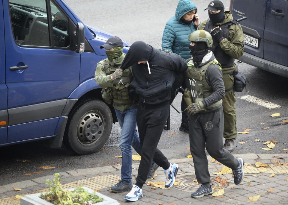 Police detain a man during an opposition rally to protest the official presidential election results in Minsk, Belarus, Sunday, Nov. 8, 2020. Club-swinging police went after demonstrators in the Belarusian capital who were demanding the resignation of the country's authoritarian president on Sunday, the 90th consecutive day of protests in the country. Human rights activists said nearly 400 people were arrested. (AP Photo)