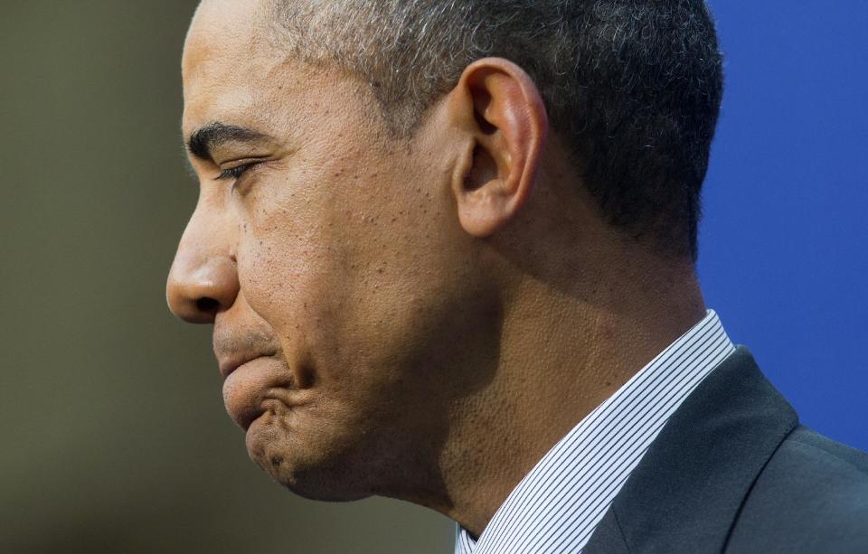 President Barack Obama Obama pauses before answering a question during a joint news conference with Dutch Prime Minister Mark Rutte at the conclusion of the Nuclear Security Summit in The Hague, Netherlands, Tuesday, March 25, 2014. (AP Photo/Pablo Martinez Monsivais)